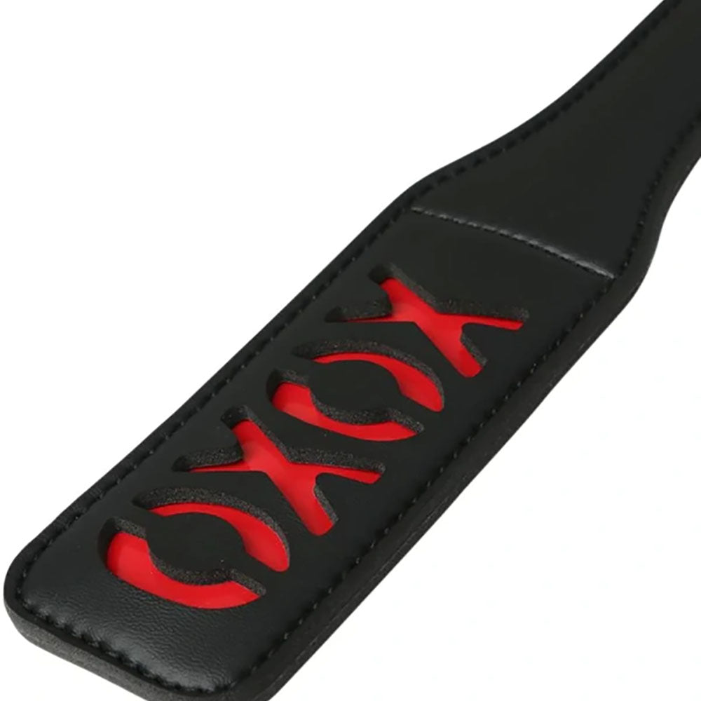 Sex & Mischief XOXO Black Vinyl Paddle with Red Cheeky Design, 30 cm Length, Includes matching Wrist Strap Whips & Paddles