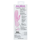 A boxed adult novelty product labeled AURA Thrusting Bunny, shown upright on a plain white background. The package is mostly white with pink and purple text and a pink illustration of the bunny insert.
